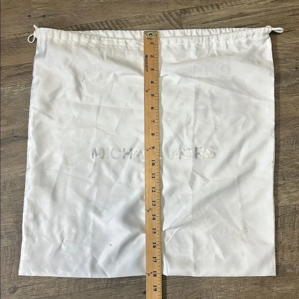 A13 | Michael Kors white dust jacket